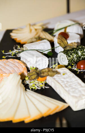 Cheese appetizing set on wooden board Stock Photo
