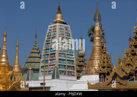 Shrines and stupas around the Beautiful Shwedagon Pagoda that dominates over Yangon. Myanmar. Stock Photo