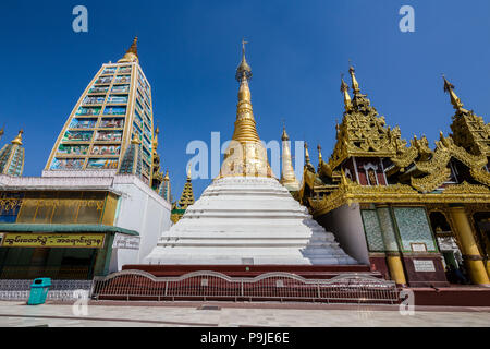 Shrines and stupas around the Beautiful Shwedagon Pagoda that dominates over Yangon. Myanmar. Stock Photo