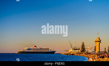 Adelaide, Australia - February 16, 2018: Cunard Line RMS Queen Mary 2 with people on board departing for a cruise from Outer Harbour, Port Adelaide Stock Photo