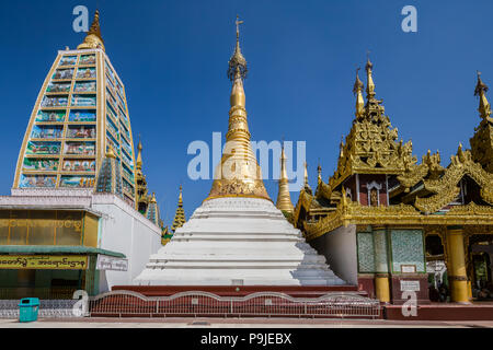 Shrines and stupas around the Beautiful Shwedagon Pagoda that dominates over Yangon. Myanmar. Stock Photo