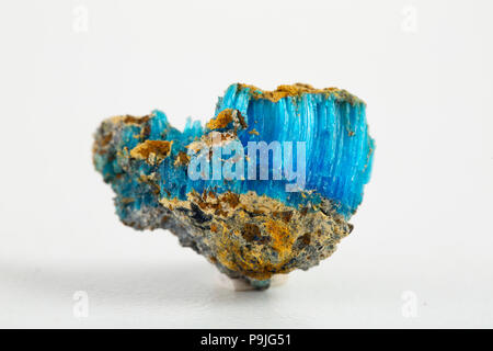 Blue mineral chalcanthite (copper sulfate) on stone on a white background Stock Photo