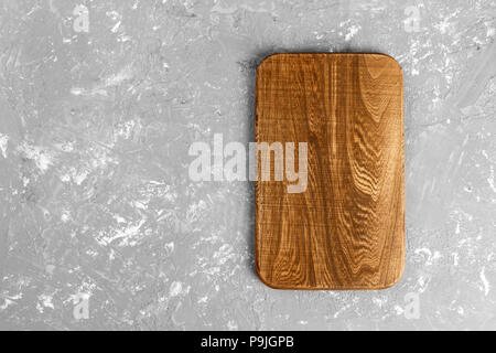 Cutting board on wooden background top view with copy space. Stock Photo