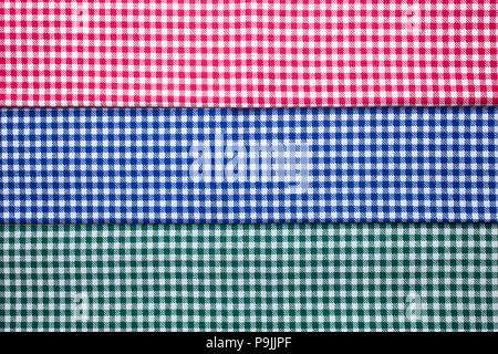 A set of napkins in a colored cage, red, blue, green Stock Photo