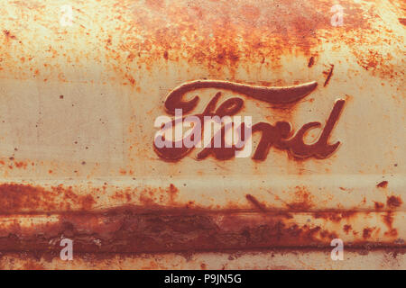 Classic Ford logo on a vintage tractor body. Stock Photo