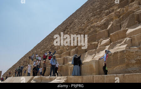 Tourists on the great pyramid of Giza, Egypt Stock Photo