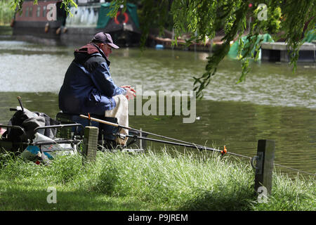 Fishing on the river Great Ouse from a modern Coracle Stock Photo - Alamy