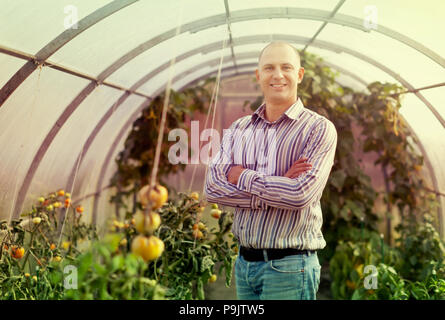 Portrait of  farmer  in greenhouse Stock Photo