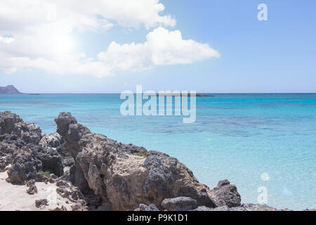 Landscape with seaside beach rocks and turquoise clear water, in summer Stock Photo