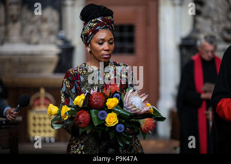 Zamaswazi Dlamini-Mandela, grand-daughter of Nelson Mandela, lays a wreath during a service to mark the centenary of the birth of the former South African President at Westminster Abbey in London where a memorial stone was dedicated to the late South African Leader. Stock Photo