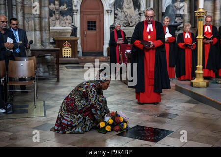 Zamaswazi Dlamini-Mandela, grand-daughter of Nelson Mandela, lays a wreath by a memorial stone during a service to mark the centenary of the birth of the former South African President at Westminster Abbey in London. Stock Photo