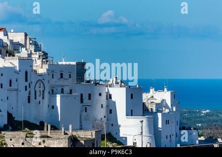 Ostuni is a village in Salento, part of the Apulia region, in southern Italy. Every year all houses are painted white, but not Cathedral and Churches. Stock Photo