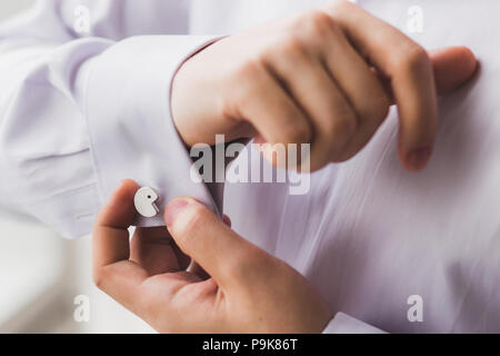 Man wearing cufflinks in Pacman shape close-up. Funny style pac man Stock Photo
