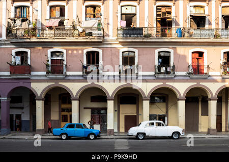 Blue Lada and white Volga old cars parked on the road in Havana, Cuba. Stock Photo