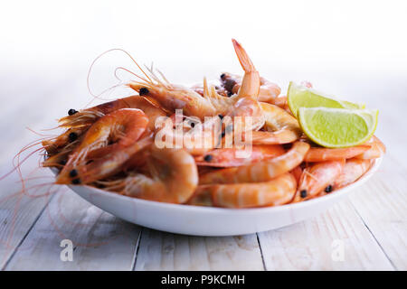 Big boiled shrimps in white plate Stock Photo