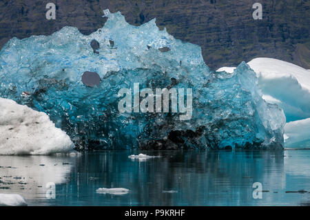 Detail of a recently flipped iceberg on Jökulsárlón (Glacier River Lagoon) during a sunny day, Iceland Stock Photo
