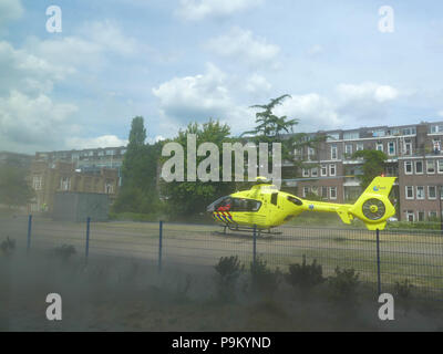 Rietland park, Amsterdam, the Netherlands -July 18 2018: emergency medical trauma helicopter lands in Amsterdam to attend victims of traffic accident Credit: Andrew Balcombe/Alamy Live News Stock Photo