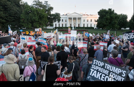 Washington, DC, USA. 18th July, 2018. Early evening demonstrators in front of the White House protesting President Donald Trump’s “treasonous” relationship with Russian President Vladimir Putin, as became obvious during Trump’s recent trip to Europe and Russia.  Bob Korn/Alamy Live News Stock Photo