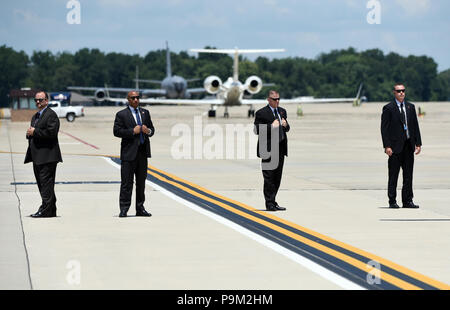 Secret Service agents stand still before U.S. President Donald Trump and First Lady Melania Trump arrive at Joint Airforce Base Andrews to pay their respects to the family of fallen United States Secret Service Special Agent Nole Edward Remagen who suffered a stroke while on duty in Scotland., July 18, 2018 in Maryland. Credit: Olivier Douliery/Pool via CNP /MediaPunch Stock Photo