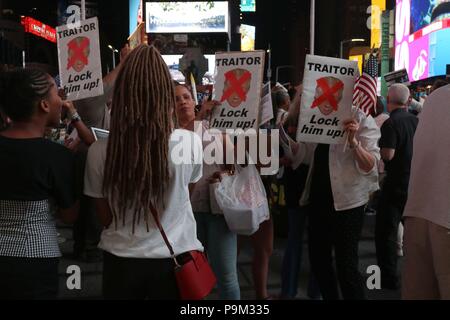 New York, NY USA. 18th. Jul, 2018. Hundreds of protesters gathered in Times Square, New York for a rally called Confront Corruption and Demand Democracy along with other rallies staged across the US on Wednesday, July 18, 2018. Protesting Donald Trump presidency, many voiced concerns over attacks on the rule of law to conflicts of interest, ethics violations and flagrant abuse of government offices for personal gain, the corruption of the American government by the President, his associates and many in his party, among other  things. © 2018 G. Ronald Lopez/DigiPixsAgain.us/Alamy Live News Stock Photo