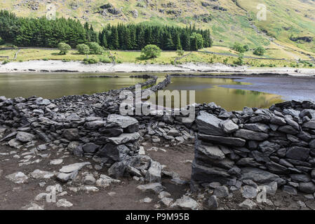 Haweswater, Cumbria UK. 19th July, 2018. An obvious doorway into an old property that was demolished to make way for the water that now fills the valley. Mardale Green was evacuated to make way for Haweswater Reservoir that was filled in the 1930's to aid drinking water to be pumped to Manchester over 80-miles away. Pic taken 19/07/2018. Credit: Stop Press Media/Alamy Live News Stock Photo