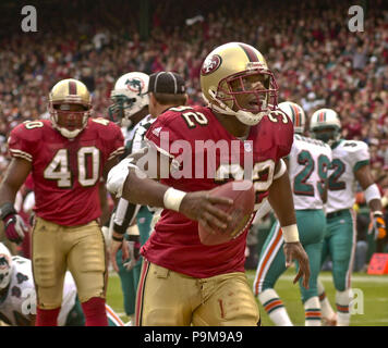 December 16, 2001 - San Francisco, California, U.S - San Francisco 49ers  running back Garrison Hearst (20) gets past Dolphin defenders on Sunday,  December 16, 2001, in San Francisco, California. The 49ers