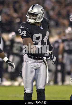 Oakland, California, USA. 5th Nov, 2001. Oakland Raiders wide receiver Jerry  Rice (80) gets away from Denver Broncos defensive back Deltha O'Neal (24)  on Monday, November 5, 2001, in Oakland, California. The