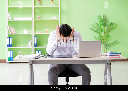 Doctor radiologist looking at x-ray scan in hospital Stock Photo