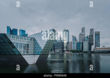 Louis Vuitton Marina Bay store exterior with background of Singapore downtown skyscrapers. Stock Photo
