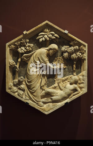 Creation of Adam depicted in the hexagonal relief by Italian Renaissance sculptor Andrea Pisano (1334-1343) from the Giotto's Campanile (Campanile di Giotto), now on display in the Museo dell'Opera del Duomo (Museum of the Works of the Florence Cathedral) in Florence, Tuscany, Italy. Stock Photo