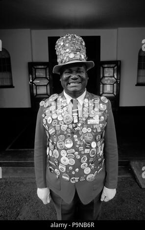 ODWELL the famous doorman at the VICTORIA FALLS HOTEL displays his collection of buttons on his attire Stock Photo