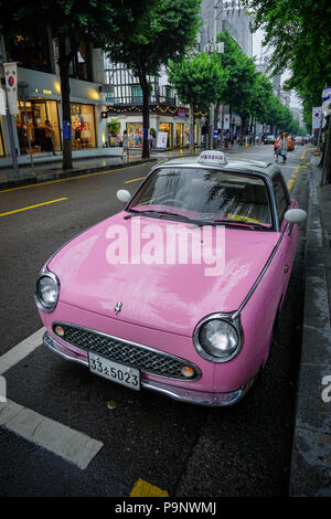 Seoul, South Korea - May 13, 2018 : Cute little pink vintage car on the street of Garosugil. Love the unique street scenes in this area. Stock Photo