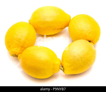 Group of five whole yellow lemons in round isolated on white background Stock Photo