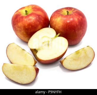 Two whole Kanzi apples, one half, three slices, isolated on white background Stock Photo