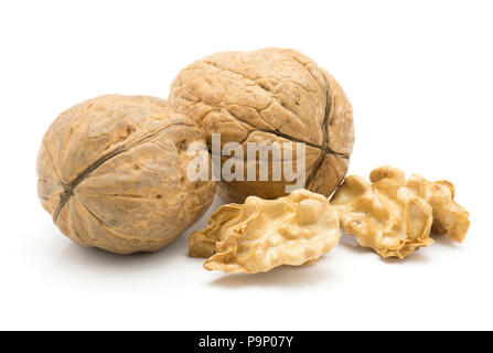 Walnuts isolated on white background two unshelled and two shelled nut halves Stock Photo