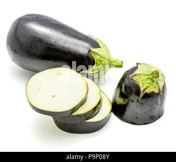 One whole and sliced eggplant (aubergine), cut in three round circles, isolated on white background Stock Photo