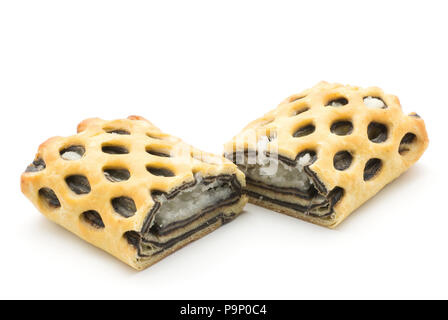 Sliced lattice bread two halves with coconut and chocolate mousse inside isolated on white background fresh baked Stock Photo