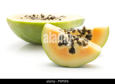 Sliced green papaya (pawpaw, papaw) one half and two slices with seeds isolated on white background Stock Photo