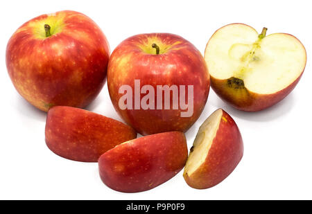 Two whole Kanzi apples, one half, three slices, isolated on white background Stock Photo