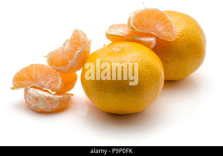 Tangerines isolated on white background two whole and separated segments Stock Photo