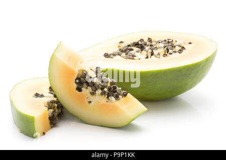 Sliced green papaya (pawpaw, papaw) isolated on white background one half and two slices orange flesh with seeds Stock Photo