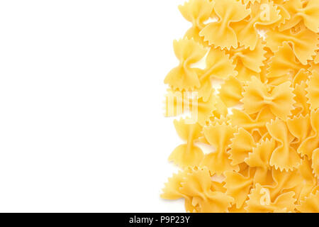 Raw farfalle top view isolated on white background dry pasta pieces right side Stock Photo