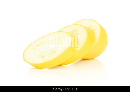 Group of three slices of raw yellow zucchini isolated on white Stock Photo