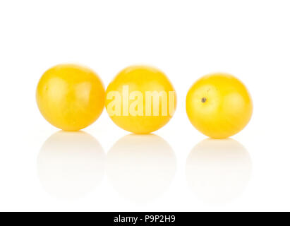 Three yellow grape cherry tomatoes isolated on white background Stock Photo