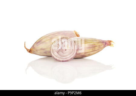 Two peeled shallots and one ring slice isolated on white background Stock Photo