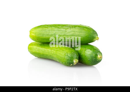 Three fresh mini cucumbers isolated on white background Stock Photo