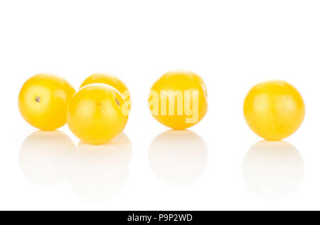 Five yellow grape cherry tomatoes isolated on white background Stock Photo
