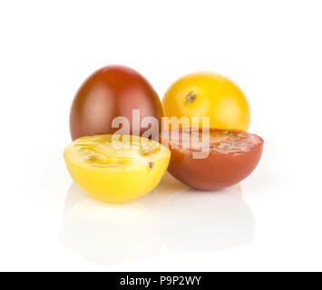 Grape cherry tomatoes mix collection isolated on white background two black red and yellow varieties with two sliced section halves Stock Photo