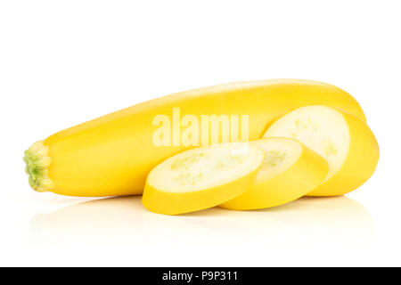Group of one whole three slices of raw yellow zucchini isolated on white Stock Photo