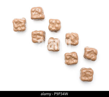 Milk chocolate coconut cubes top view isolated on white background Stock Photo